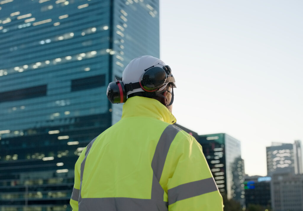 construction worker and cityscape office building development